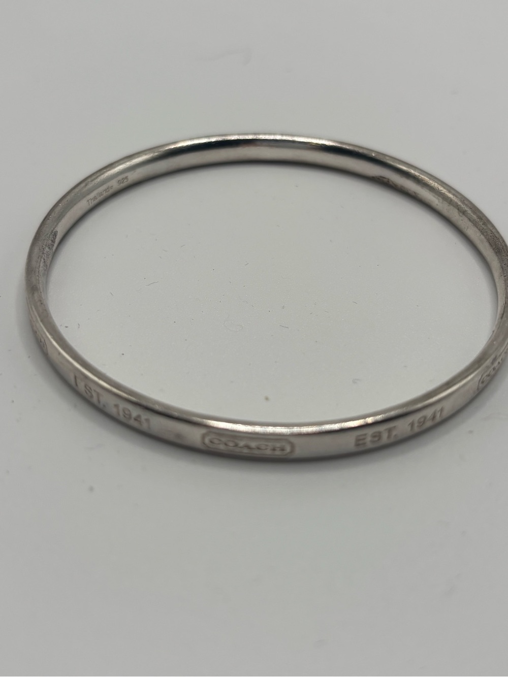 Coach Sterling Silver 
Signature Bangle Bracelet